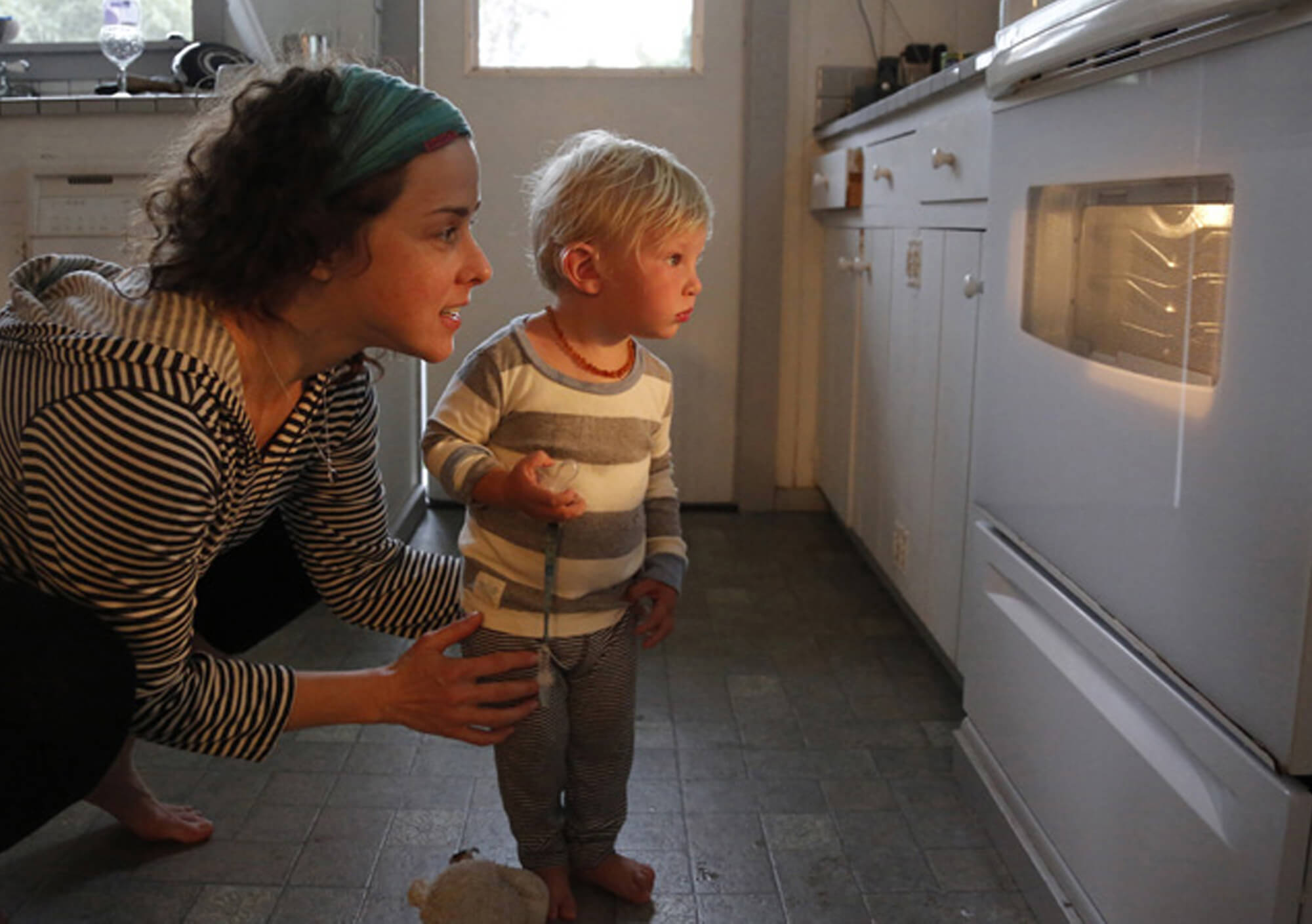 Mother and Child looking at oven