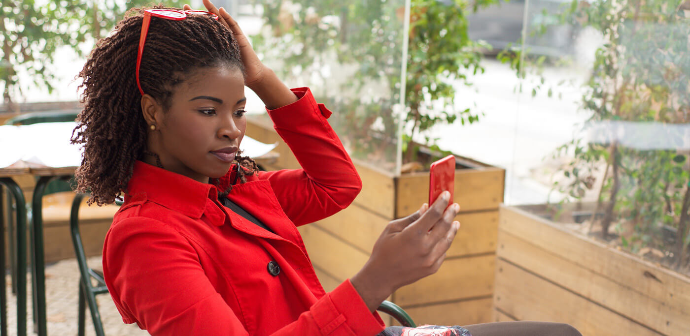 Women reading her mobile phones