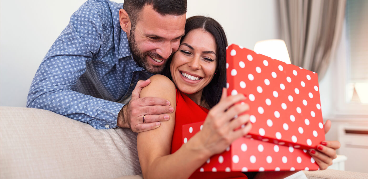 Man give women a red gift box