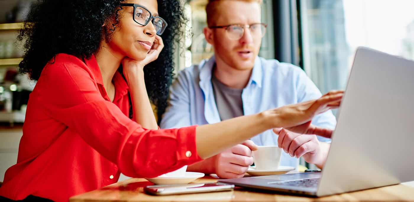 Colleagues working together on laptop