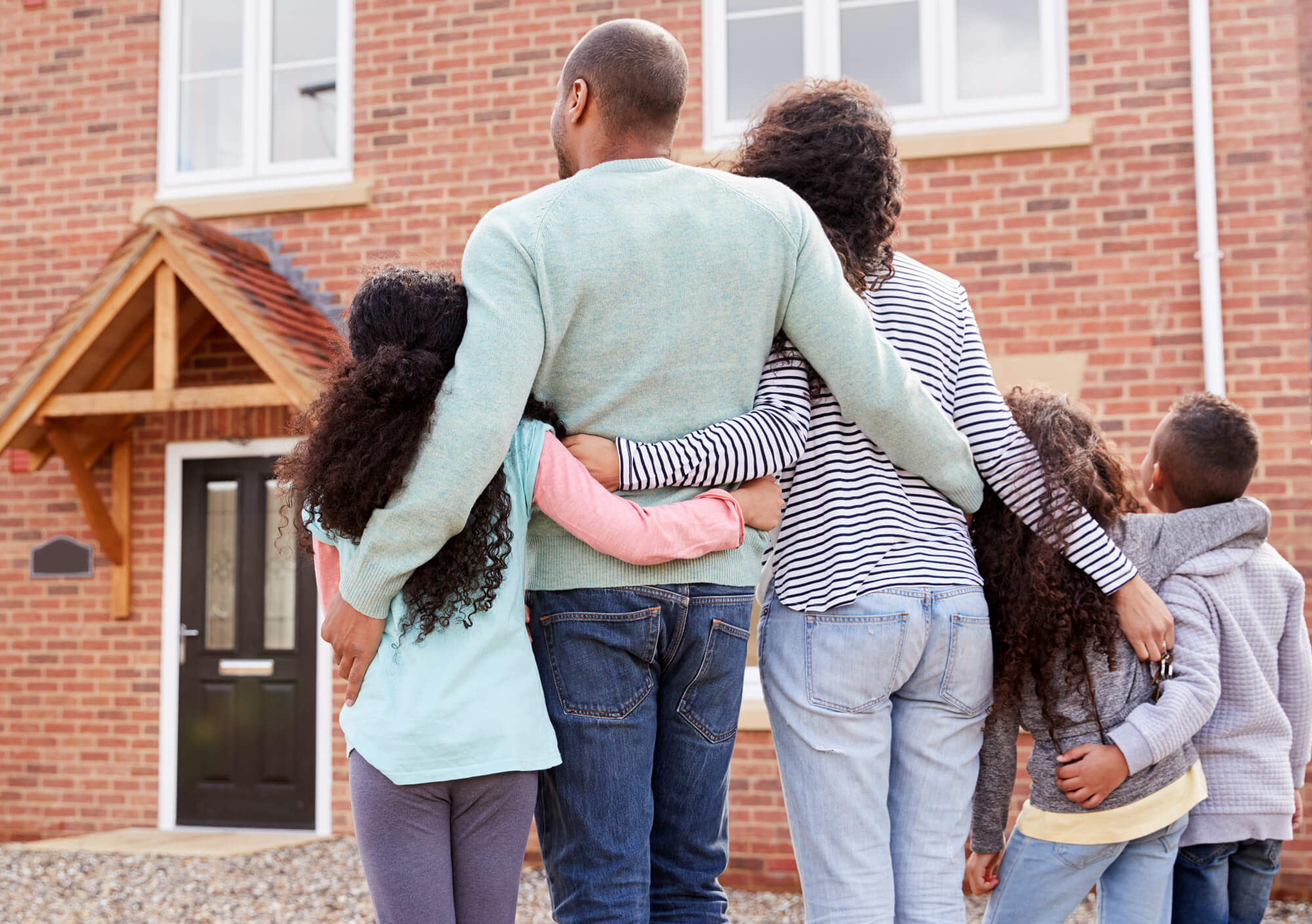 A family outside their home
