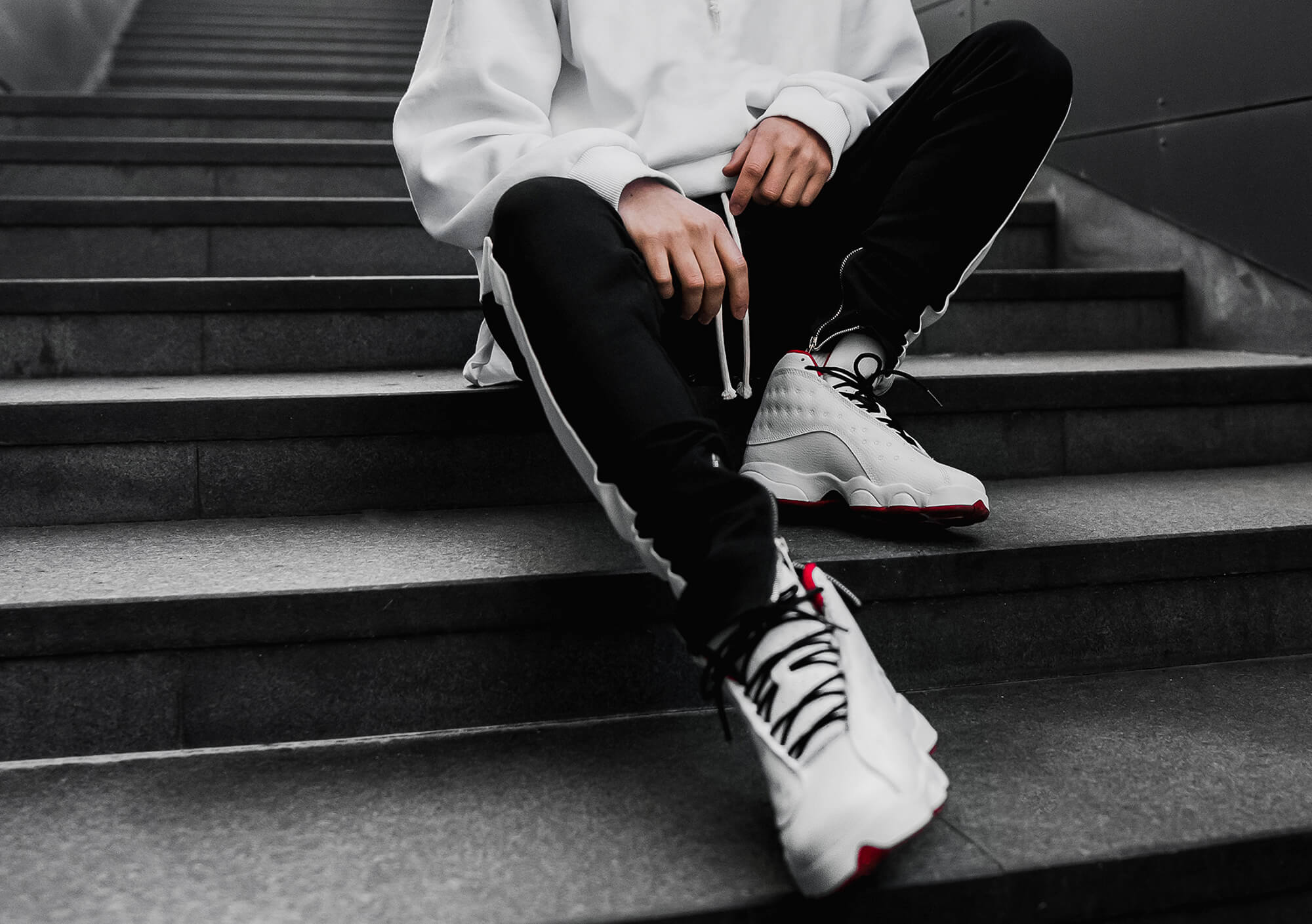 Man on stairs wearing traininers