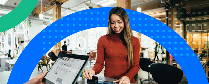 Women in shop paying by card