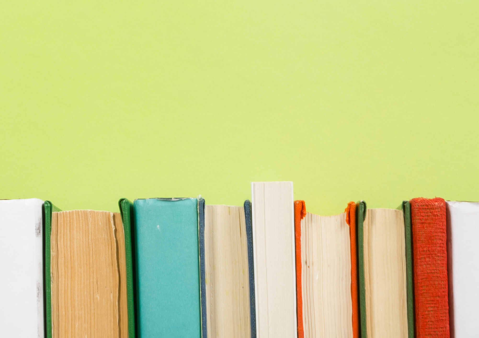 Books on a green background